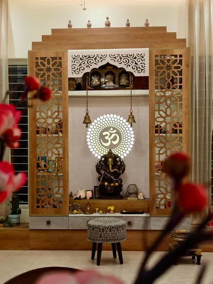 We take great pride in creating sacred spaces that blend tradition with timeless design. This pooja unit is a testament to our craftsmanship, featuring intricate jali work, a backlit 'Om' centerpiece, and dedicated niches for idols, creating a corner of divine elegance and peace.