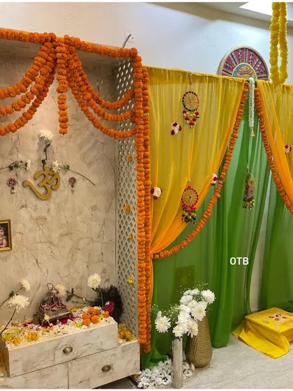 A closer look at the pooja mandap setup. I used a lattice screen, marigold torans, and sheer drapes to create a sacred and beautifully decorated corner within the home.