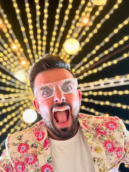 A fun, quirky shot against a backdrop of festive lights, capturing the playful side of my hosting style.