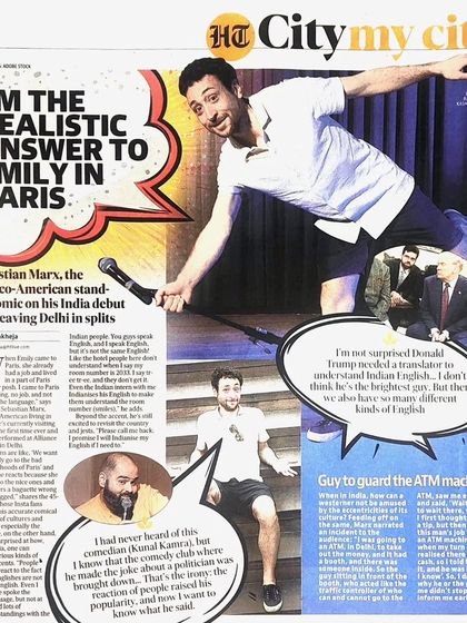 A newspaper clipping from Hindustan Times City featuring comedian Sebastian Marx. The headline "I'm the realistic answer to Emily in Paris" captures his witty, cross-cultural humour, which we were thrilled to host.