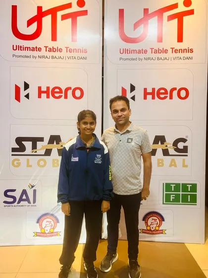 Our player Swara Jangade standing with her coach before competing at the Cadet & Sub-Junior National Championship in Indore, where she was selected to represent the Maharashtra U-15 girls' team.