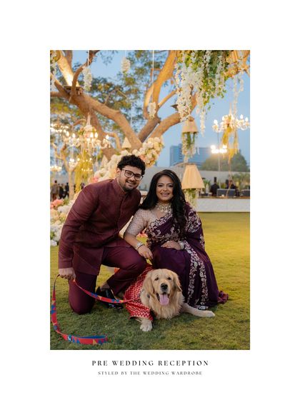 A beautiful shot of the couple with their furry family member, Ellis, who wore a custom Patola-print outfit.