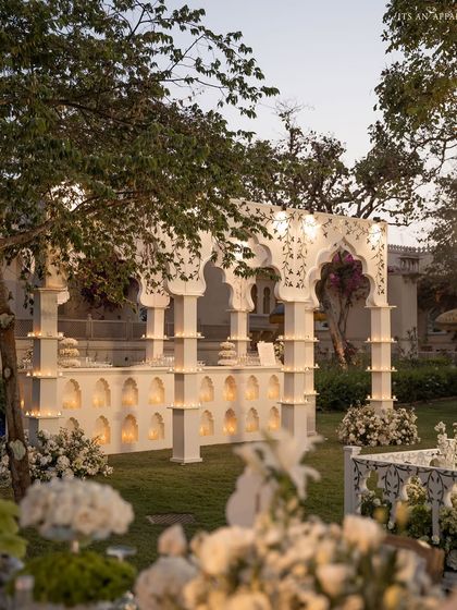 The stunning architectural bar structure stands as a focal point in the garden, blending seamlessly with the natural surroundings.