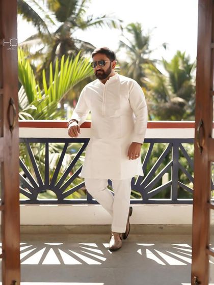 You can't go wrong with neutral tones. A crisp white kurta is a timeless and versatile staple for any festive wardrobe.