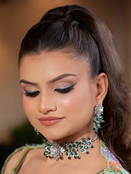 A soft, glamorous makeup look paired with our emerald and diamond-style jewellery set. This shows how my pieces can complement a modern aesthetic for any special occasion.