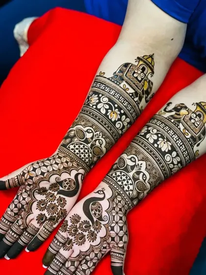 Another beautiful design featuring elephants in a procession and graceful peacocks, perfect for a traditional bride.