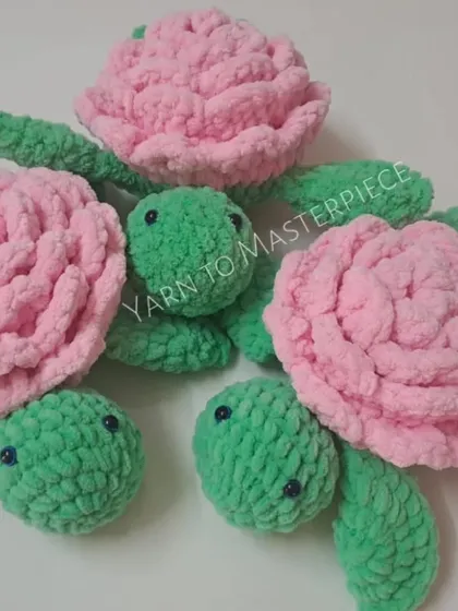Three plush rose turtles in two different color combinations: pink and green, and a darker magenta and green.