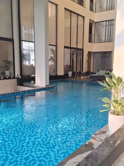 The beautiful and inviting pool area of my hotel in Goa. This image sets the scene for a perfect tropical holiday.