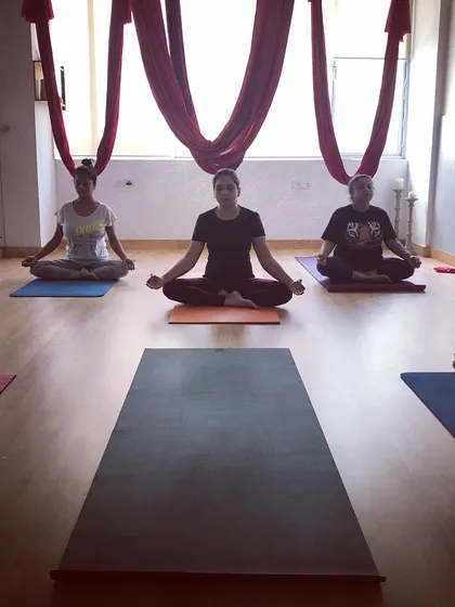 Ending a fun-filled private aerial party with a moment of calm. After all the flying and laughing, we take time to sit in meditation and soak in the good vibes.