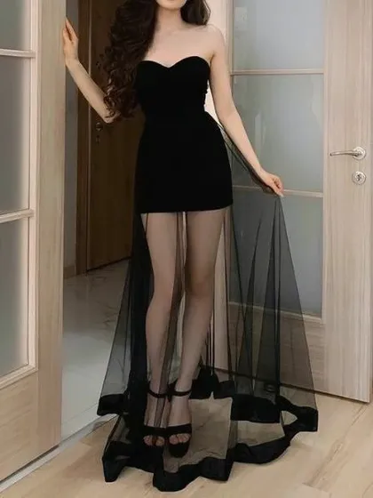 A dramatic and unique party dress. This design features a black strapless mini dress with a sheer, floor-length organza overlay for a high-fashion, statement-making look.