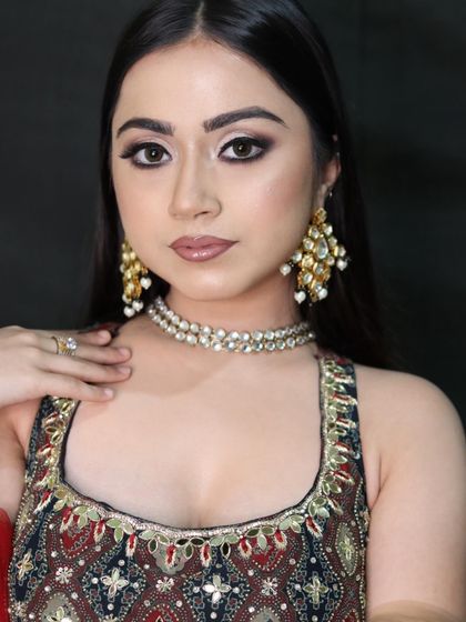 A direct portrait showcasing the sharp and clean lines of the cut-crease eye makeup, paired with a neutral lip.