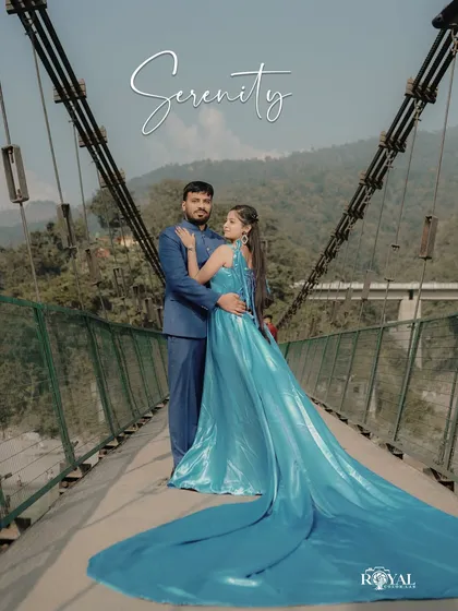 A fairytale moment on one of Rishikesh's iconic suspension bridges. The bride's flowing aquamarine gown contrasts beautifully with the rugged mountains, creating a truly breathtaking portrait that feels both grand and intimate.