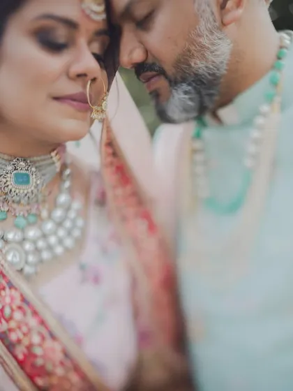 In the middle of all the beautiful chaos, we find these quiet pockets of peace. A simple, intimate portrait of a couple lost in their own world, showcasing the soft, romantic side of their love story through our candid wedding photography.