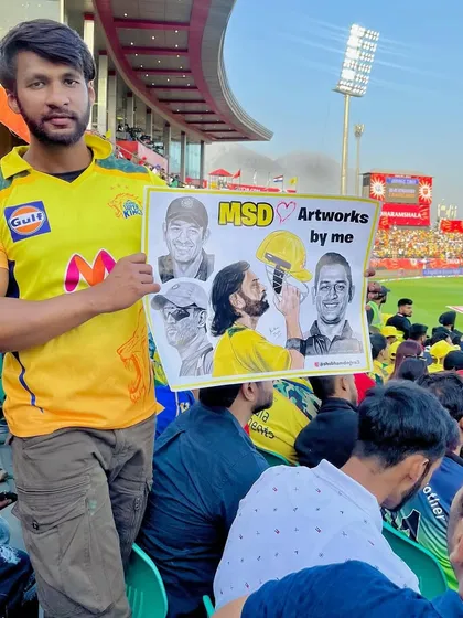 Supporting my favorite player, MS Dhoni, at a CSK match in Dharamshala. I brought along a poster showcasing some of my many artworks of the legend.