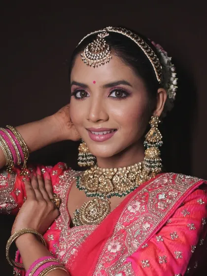 Another angle of the pink bridal look, showing the beautiful smile of the model.