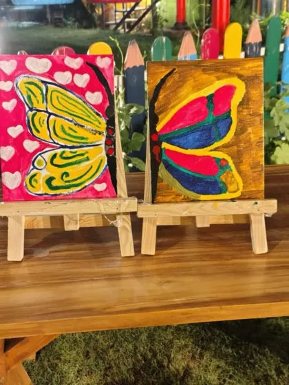The beautiful results of our butterfly painting workshop, displayed on mini easels. Each child gets to take their artwork home as a souvenir.