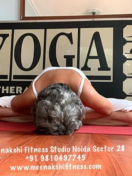 A closer view of the forward bend in Baddha Konasana, highlighting the release in the hips and back.