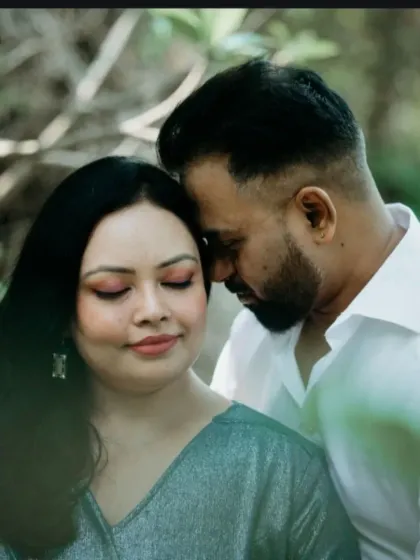 An intimate close-up from an outdoor pre-wedding shoot. We focused on the couple's gentle embrace, capturing a quiet moment of connection amidst nature.