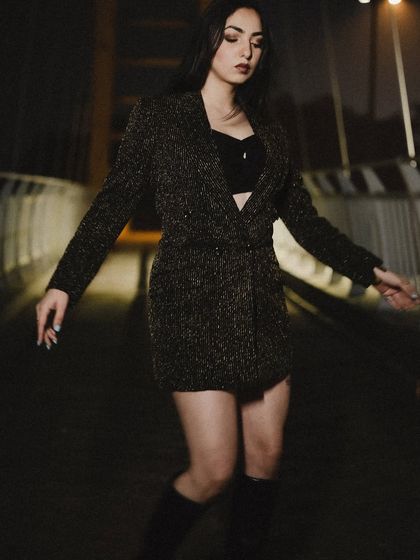 A candid-style movement shot, adding a sense of realism to the editorial look.