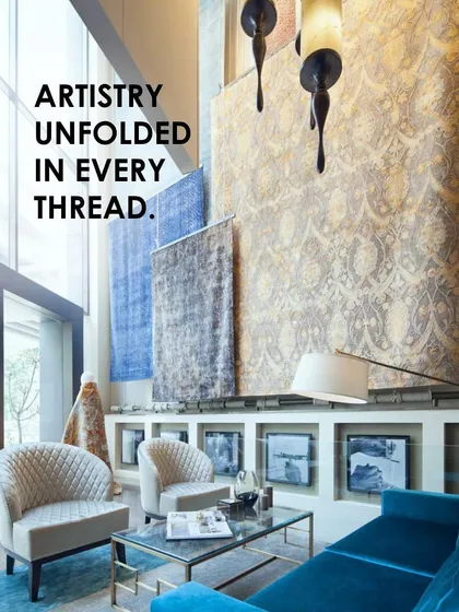 The double-height 'showstopper' display at the Hands Carpets showroom in New Delhi. We designed the space to elevate carpets to the stature of art, using dramatic scale and lighting to create a curated gallery experience for customers.