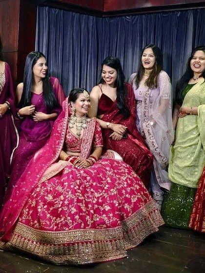 The bride surrounded by her squad! This candid shot captures the laughter and camaraderie between the bride and her bridesmaids, a perfect memory of her support system.