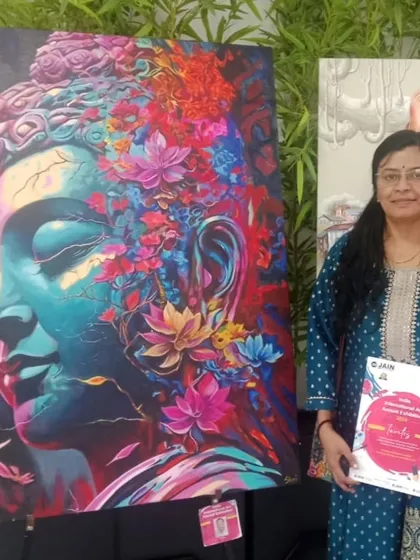 Standing proudly with my vibrant, floral Buddha painting at the India International Art Annual Exhibition. This piece combines two of my favorite subjects, spirituality and nature, and features 3D elements for a unique texture.