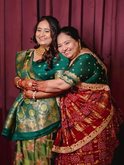 A heartwarming hug between the bride and her mother. I created complementary looks for them, ensuring the bride remained the star while her mom looked equally elegant.