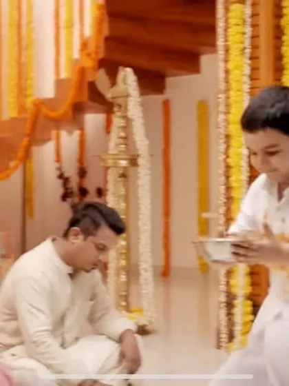 A moment of innocent mischief from the Surf Excel commercial, where a little boy gets his pristine white mundu stained during the Onam celebration.