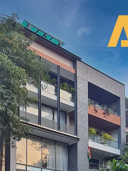 This residential facade boasts a striking display of modern architecture with expansive balconies. These serve as both functional spaces and design elements that contribute to the contemporary charm and openness of the building.