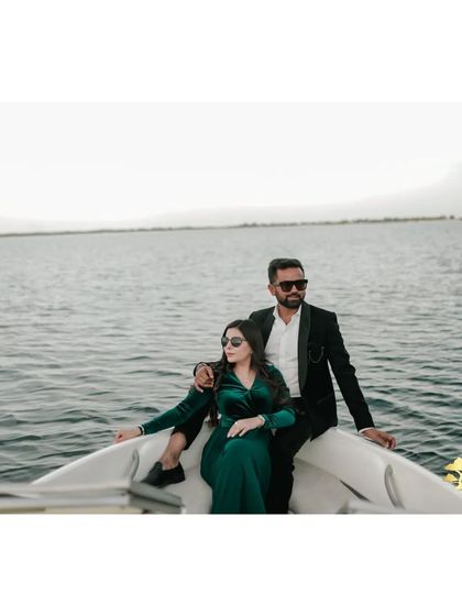 A stylish shot of the couple on a boat, looking cool and relaxed. This captures the luxury and leisure of a destination shoot.