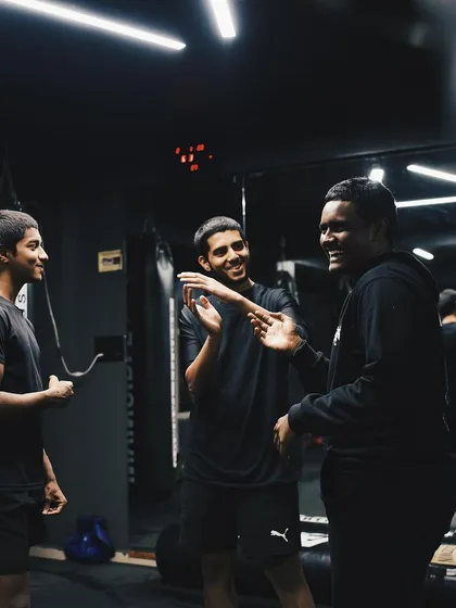 Laughter and camaraderie between rounds. We train hard, but we are a team.