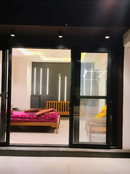 The terrace room at night, showcasing the clear view from the outside in. Our structures are designed to be visually appealing both day and night.