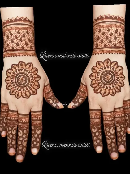A simple yet striking mandala design. The clean, symmetrical pattern on the palm is perfect for someone who wants a classic and elegant look for a festival or party.