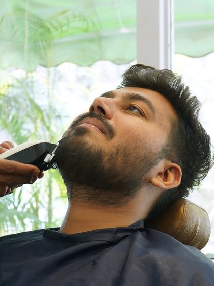 For beard maintenance and shaping, I use professional-grade clippers to achieve the desired length and texture. This ensures an even, well-maintained look for any beard style.