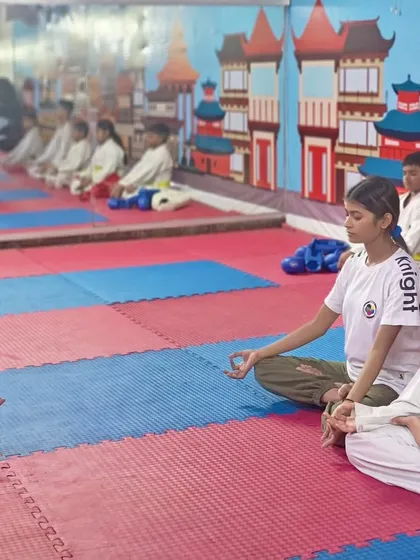 At our academy, we train the mind along with the body. A group meditation session in progress, helping students of all ages improve focus, reduce stress, and find inner balance.