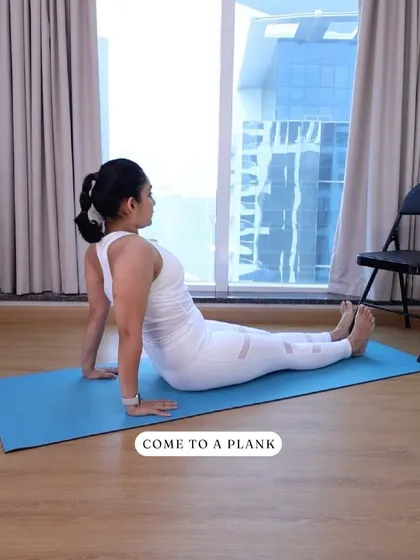 To begin a reverse plank, sit on your mat with your hands behind you. This starting position ensures you can lift into the plank with proper form and alignment.