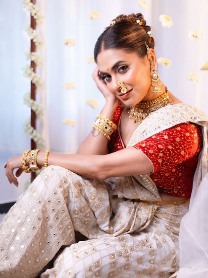 A relaxed and graceful pose showing the full effect of the modern Peshwai styling. The makeup is flawless, and the entire look exudes a calm, royal confidence.