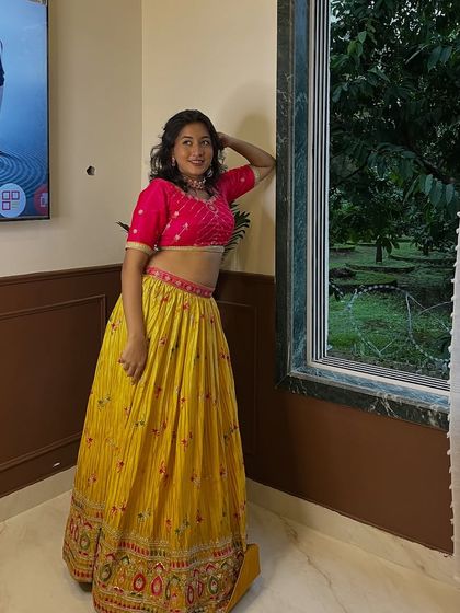 This yellow and pink chanya choli is a classic combination for Navratri. It's bright, festive, and looks great on everyone.