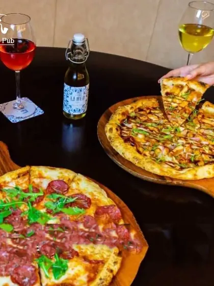 The perfect pairing: two of our delicious pizzas served with wine. A great option for a dinner date or a meal with friends.