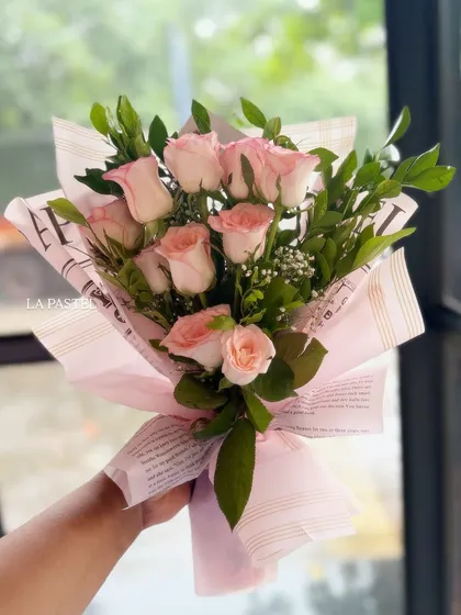 A beautiful bouquet of fresh pink roses, ready to be paired with one of my custom bento cakes for a thoughtful gift.