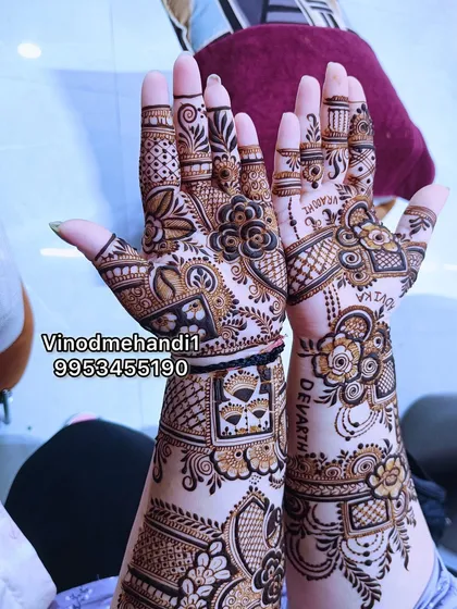 A unique bridal design that includes personalized names 'Devansh' and 'Devika' written in a stylish font, integrated seamlessly with floral and geometric patterns.