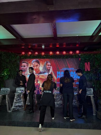 Our team setting up the stage for the Netflix 'Mandala Murders' press event. We ensure the setup matches the theme and technical requirements.