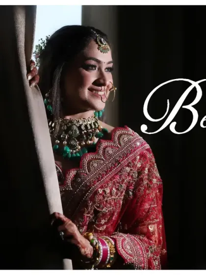 A perfect example of a timeless bridal portrait. The bride is framed by a curtain, using natural light to create a soft and elegant silhouette. This is a classic shot that every bride loves.