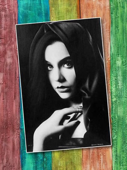 A student's realistic pencil portrait, showcasing their ability to create depth and emotion using only shades of grey.