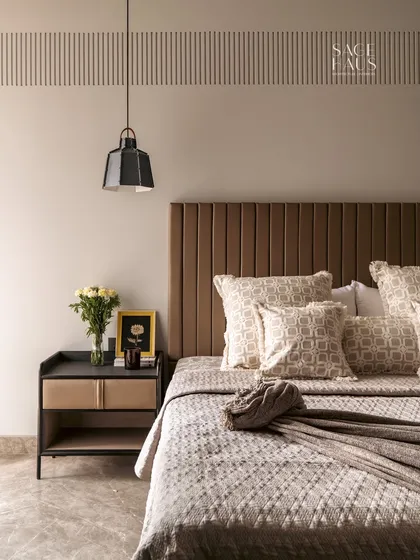 This bedroom is designed as a personal sanctuary. I layered soft neutral tones, rich textures, and modern details, from the vertically channeled headboard to the minimalist pendant light. Every element is chosen to evoke comfort and understated luxury.