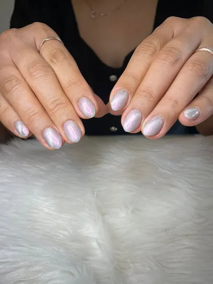 A soft, shimmery cat eye effect on short, natural nails.