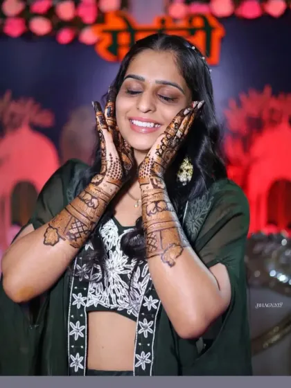 The pure joy of a bride-to-be, framed by her beautifully decorated hands.
