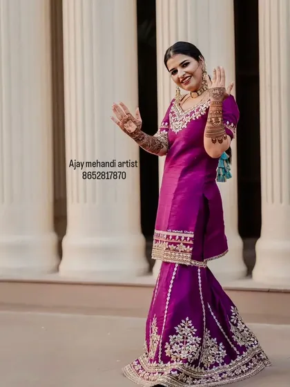 Another shot of the happy client, showing her mehndi from a distance.