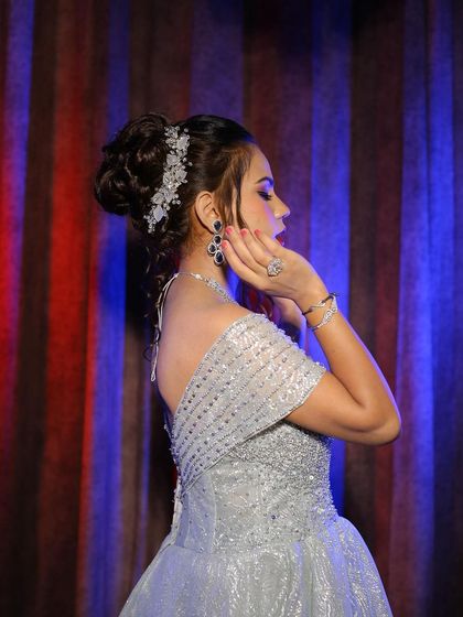 A complete engagement look photoshoot featuring our silver off-shoulder ball gown. The series of five images provides a comprehensive look at the final result.