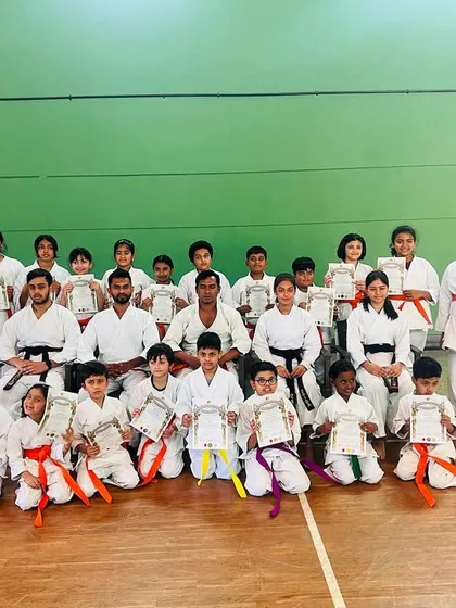 Our growing dojo family. Celebrating with 25 of my students who were promoted to their next belt level. Each certificate represents hours of dedication and hard work.